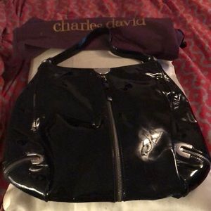 Navy blue patent leather hobo type handbag